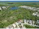 Aerial view of a two-story light blue house, located in a quiet residential neighborhood at 5112 Coastal Scene Dr, Apollo Beach, FL 33572
