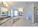 Bathroom with soaking tub and walk in shower at 5112 Coastal Scene Dr, Apollo Beach, FL 33572