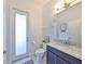 Modern bathroom with granite vanity, updated fixtures, and stylish flooring at 5112 Coastal Scene Dr, Apollo Beach, FL 33572