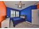 Bright bedroom with double windows, ceiling fan, and plush carpeting at 5112 Coastal Scene Dr, Apollo Beach, FL 33572