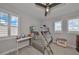 Cozy bedroom with a bunk bed, desk, and plenty of natural light at 5112 Coastal Scene Dr, Apollo Beach, FL 33572