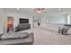 Spacious bonus room with TV, seating, and storage at 5112 Coastal Scene Dr, Apollo Beach, FL 33572