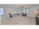 Spacious bonus room with built-in shelving and rocking chair at 5112 Coastal Scene Dr, Apollo Beach, FL 33572