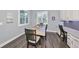 Charming breakfast nook with a table and chairs, built-in workspace, and window at 5112 Coastal Scene Dr, Apollo Beach, FL 33572