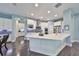 Spacious kitchen with stainless steel appliances and large island at 5112 Coastal Scene Dr, Apollo Beach, FL 33572
