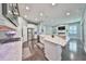 Spacious kitchen with island, stainless steel appliances, and white cabinets at 5112 Coastal Scene Dr, Apollo Beach, FL 33572