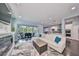Spacious living room with L-shaped sectional sofa, fireplace, and access to backyard at 5112 Coastal Scene Dr, Apollo Beach, FL 33572