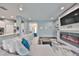 Living area showcasing a sectional sofa, fireplace, and built-in entertainment center at 5112 Coastal Scene Dr, Apollo Beach, FL 33572
