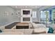 Living area with fireplace, comfortable seating, and access to patio at 5112 Coastal Scene Dr, Apollo Beach, FL 33572