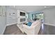 Relaxing living room featuring a fireplace and sliding glass doors at 5112 Coastal Scene Dr, Apollo Beach, FL 33572
