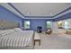 Spacious main bedroom with sitting area and access to en-suite bathroom at 5112 Coastal Scene Dr, Apollo Beach, FL 33572