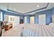 Large main bedroom with access to ensuite and sitting area at 5112 Coastal Scene Dr, Apollo Beach, FL 33572