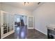 Bright office with hardwood floors and French doors leading to living area at 5112 Coastal Scene Dr, Apollo Beach, FL 33572