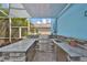 Lush outdoor kitchen with granite countertops and stainless steel appliances at 5112 Coastal Scene Dr, Apollo Beach, FL 33572