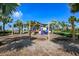 Community playground with swings and play structures at 5112 Coastal Scene Dr, Apollo Beach, FL 33572