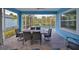 Inviting screened pool area with patio furniture and a dining table at 5112 Coastal Scene Dr, Apollo Beach, FL 33572