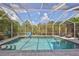 Sparkling, refreshing pool with screened enclosure at 5112 Coastal Scene Dr, Apollo Beach, FL 33572