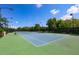 Well-maintained tennis court with green surface at 5112 Coastal Scene Dr, Apollo Beach, FL 33572