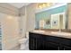 Main bathroom with double vanity, tub, and shower at 121 Lacewing Pl, Valrico, FL 33594