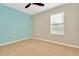 Bedroom with light blue and gray walls, carpet, and window with blinds at 121 Lacewing Pl, Valrico, FL 33594