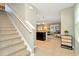 Spacious entry hall with tile floors, a staircase, and views to the kitchen and living room at 121 Lacewing Pl, Valrico, FL 33594