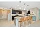Modern kitchen with an island and seating area, open to living area at 121 Lacewing Pl, Valrico, FL 33594