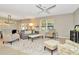 Comfortable living room with ample seating and large windows at 121 Lacewing Pl, Valrico, FL 33594