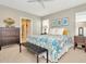 Main bedroom with dresser, king bed, and access to bathroom at 121 Lacewing Pl, Valrico, FL 33594