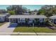 Single story home with landscaped yard and driveway at 4436 W Wallace Ave, Tampa, FL 33611