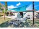 Relaxing backyard oasis with patio and shade sail at 4436 W Wallace Ave, Tampa, FL 33611