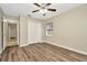 Bedroom featuring updated flooring, a ceiling fan with lights, and a closet at 10113 Tarragon Dr, Riverview, FL 33569