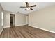 Bright bedroom with wood-look flooring and a ceiling fan at 10113 Tarragon Dr, Riverview, FL 33569