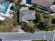 Bird's eye view of a single Gathering home with mature landscaping and a pool at 1401 Bay Palm Blvd, Indian Rocks Beach, FL 33785