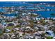 Aerial view of waterfront property with surrounding houses at 1401 Bay Palm Blvd, Indian Rocks Beach, FL 33785