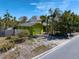 Bright green house with a one car garage and palm trees at 1401 Bay Palm Blvd, Indian Rocks Beach, FL 33785