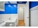 Bathroom with blue walls and a white vanity at 1120 N Shore Ne Dr # 903, St Petersburg, FL 33701