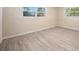 This bedroom has new flooring and two windows letting in natural light at 1978 Rebecca Dr, Clearwater, FL 33764