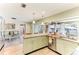 Eat-in kitchen with an open layout and access to the sunroom at 33 Harbor Woods Cir, Safety Harbor, FL 34695