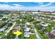 Aerial view of a single Gathering home with pool, located in a residential neighborhood near the water at 14542 Anchorage Cir, Seminole, FL 33776