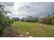 Large backyard with grassy lawn and bird bath at 14542 Anchorage Cir, Seminole, FL 33776