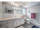 Bathroom with white vanity, tile, and flooring at 14542 Anchorage Cir, Seminole, FL 33776