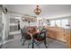 Cozy dining area featuring a rustic wood table and chairs, near the kitchen at 14542 Anchorage Cir, Seminole, FL 33776