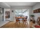 Charming dining area with wood table and chairs, offering views of a sunroom at 14542 Anchorage Cir, Seminole, FL 33776