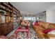 Living room showcasing a red coffee table and comfortable leather sofas at 14542 Anchorage Cir, Seminole, FL 33776