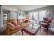 Living room with leather couch and red accent chair at 14542 Anchorage Cir, Seminole, FL 33776