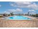 Expansive pool area with a playground and water view at 14542 Anchorage Cir, Seminole, FL 33776