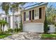 Charming home featuring a two-car garage, manicured lawn, and classic architectural details at 2527 W Maryland Ave # A, Tampa, FL 33629