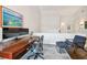 Upstairs landing showcasing a home office area with a desk, a chair and a blue rug at 2527 W Maryland Ave # A, Tampa, FL 33629