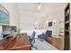 Home office upstairs with a desk, a chair, a blue rug and a view of the hallway at 2527 W Maryland Ave # A, Tampa, FL 33629