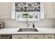 Kitchen sink with stone countertops and stainless steel sink basin at 2527 W Maryland Ave # A, Tampa, FL 33629